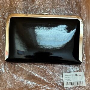 Black clutch handbag with chain.